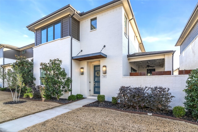 view of front of home featuring ceiling fan