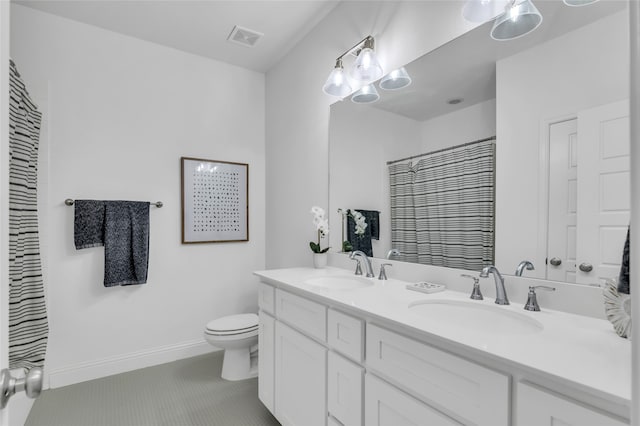 bathroom featuring vanity, tile patterned flooring, curtained shower, and toilet