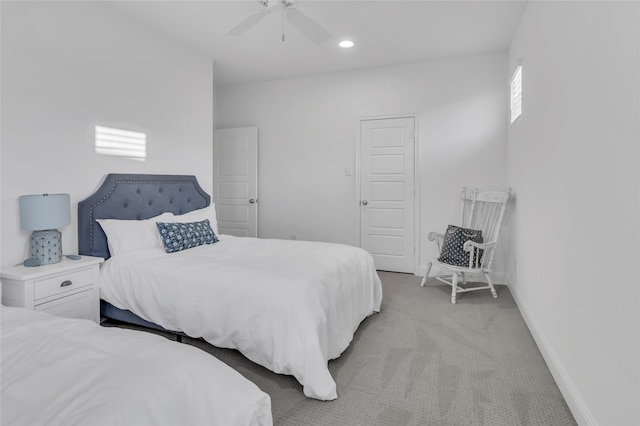 bedroom with light carpet and ceiling fan