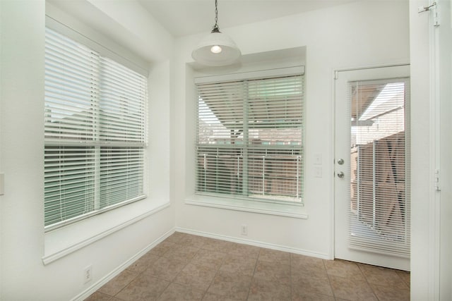 interior space with a healthy amount of sunlight and light tile patterned flooring