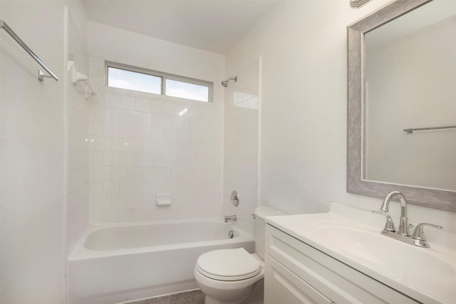 full bathroom with vanity, toilet, and tiled shower / bath combo