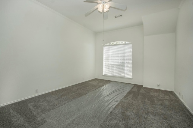 unfurnished room with ceiling fan and dark colored carpet