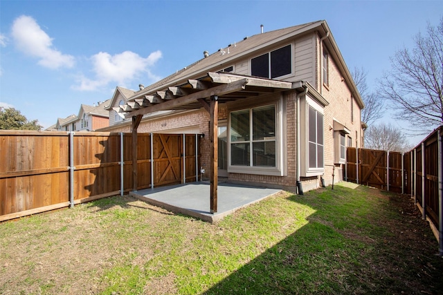 rear view of property featuring a patio area and a lawn