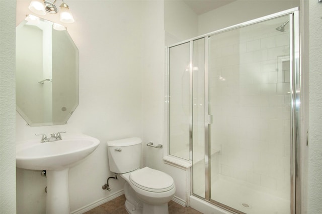 bathroom featuring walk in shower and toilet