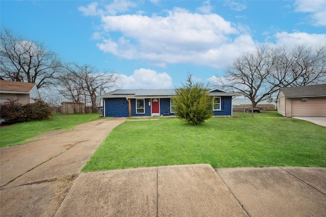 single story home with a front yard and solar panels