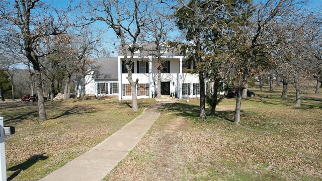 70 Hidden Valley Airpark, Shady Shores, TX 76208 - view of front of property featuring a front lawn, stucco siding, and roof with shingles
