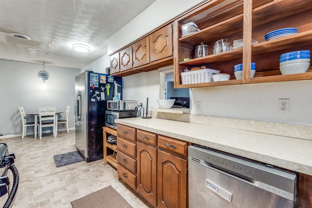 kitchen featuring pendant lighting and stainless steel appliances