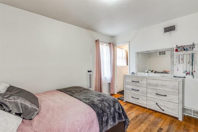 bedroom with light hardwood / wood-style flooring