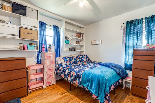 bedroom with hardwood / wood-style flooring and ceiling fan