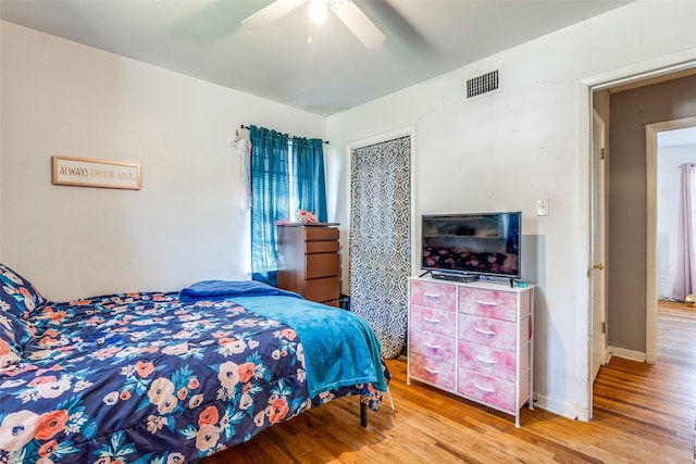 bedroom featuring ceiling fan and light wood-type flooring