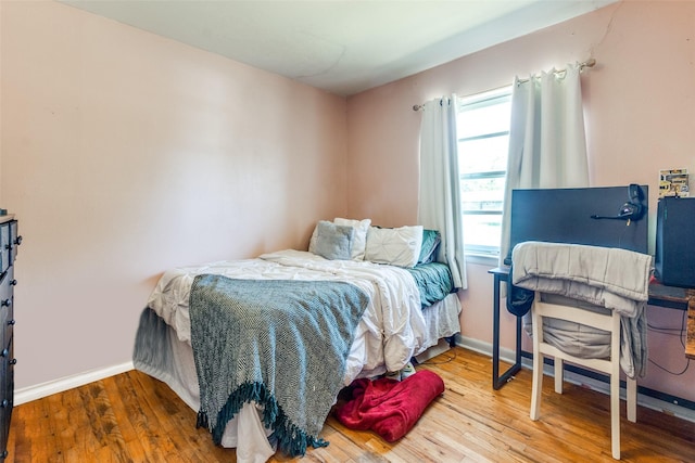 bedroom featuring hardwood / wood-style flooring