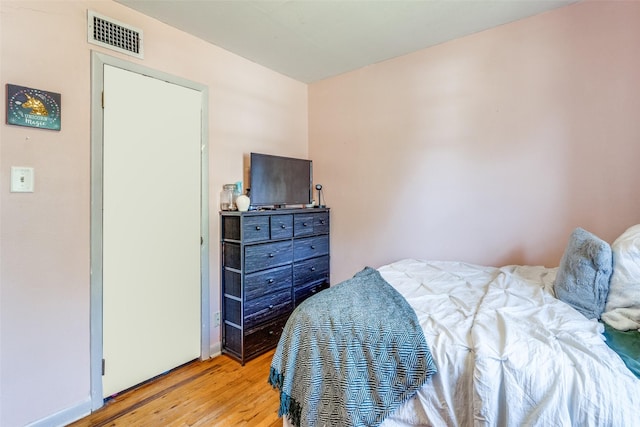 bedroom with light hardwood / wood-style floors