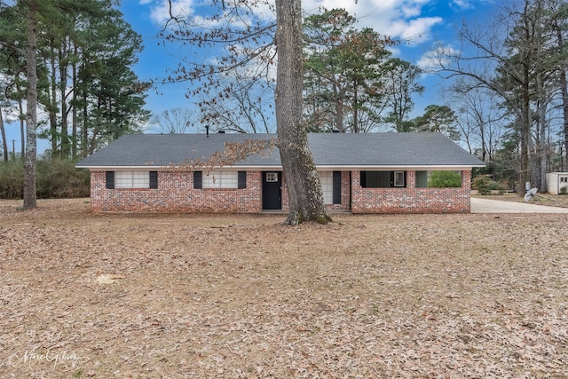 single story home with brick siding