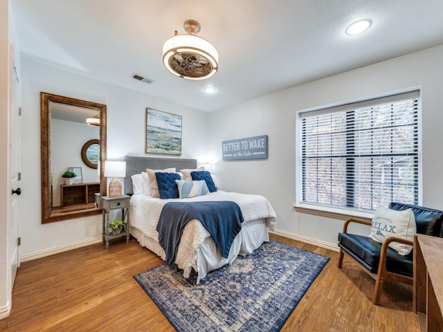 bedroom with hardwood / wood-style floors