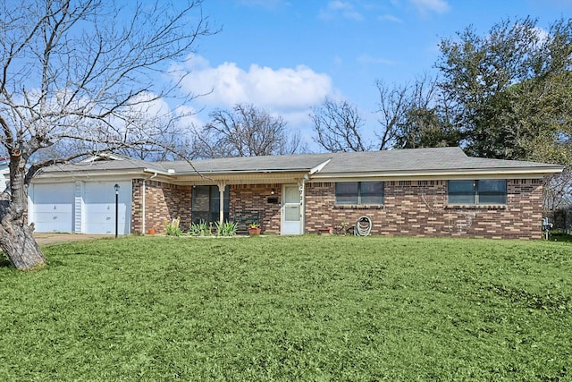 single story home featuring a front yard and a garage