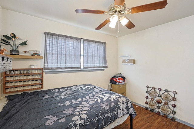 bedroom with hardwood / wood-style floors and ceiling fan