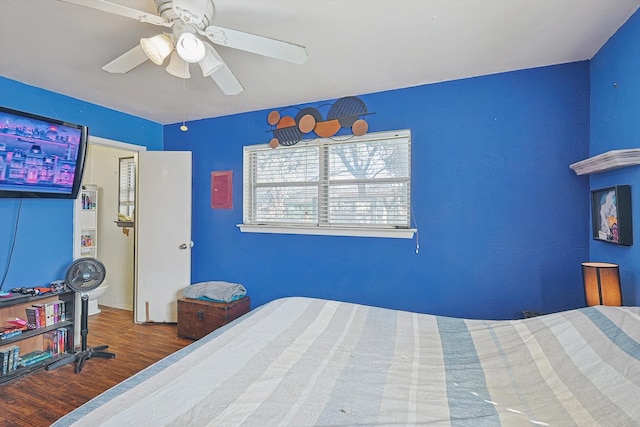 bedroom with hardwood / wood-style floors and ceiling fan