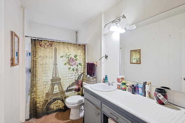 bathroom featuring a shower with curtain, toilet, tile patterned flooring, and vanity