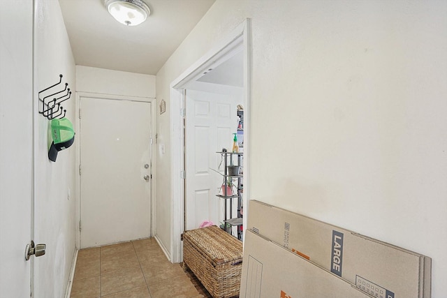 hallway featuring light tile patterned floors