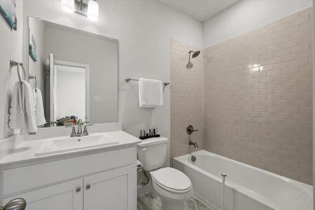 full bathroom featuring vanity, toilet, and tiled shower / bath combo