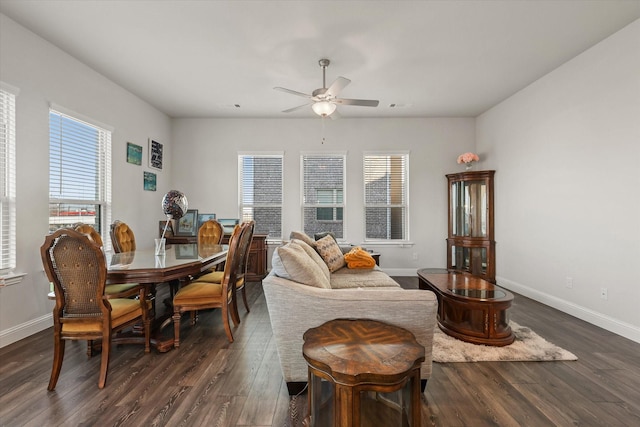 living room featuring ceiling fan, plenty of natural light, and dark hardwood / wood-style floors