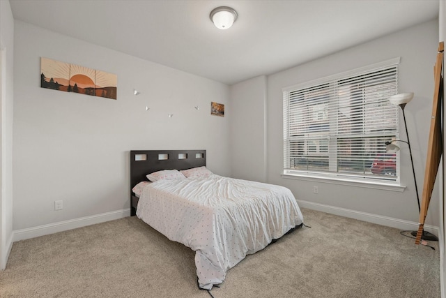 bedroom featuring light carpet