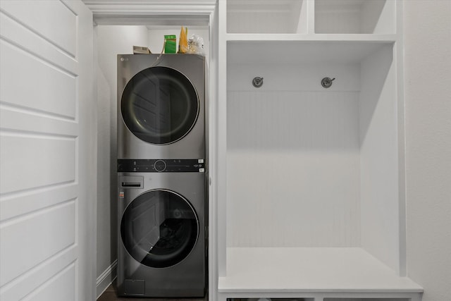 laundry room with stacked washing maching and dryer