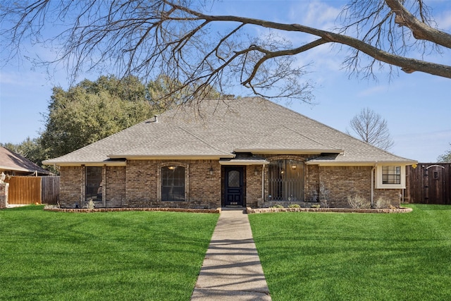 ranch-style house featuring a front lawn