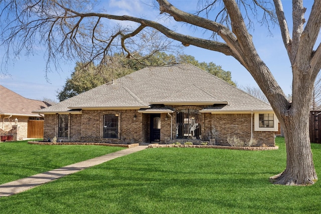 single story home with a front yard