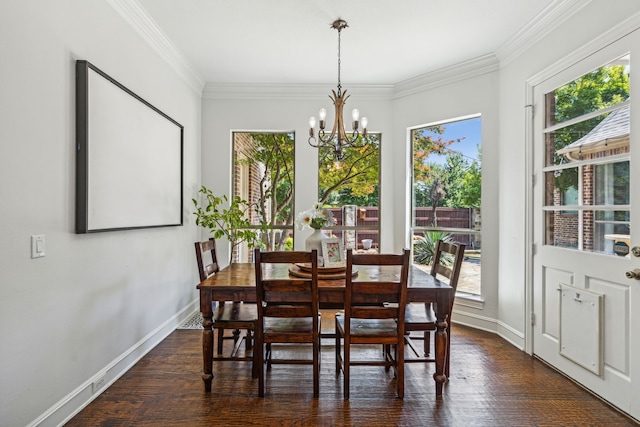 dining room with dark hardwood / wood-style flooring, crown molding, a wealth of natural light, and an inviting chandelier