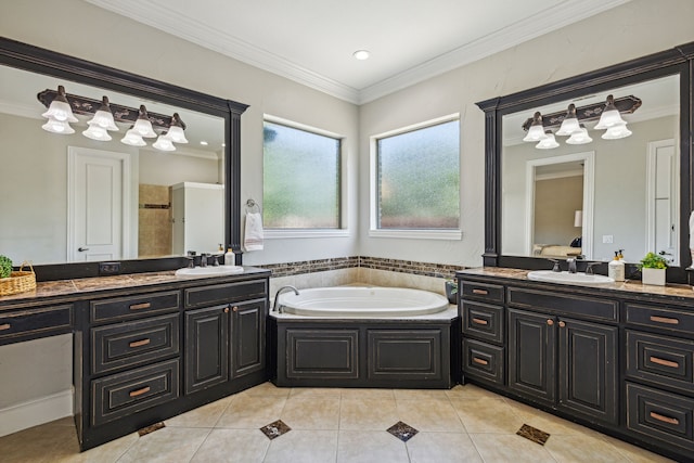 bathroom featuring ornamental molding, tile patterned flooring, vanity, and a washtub