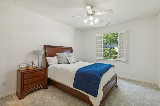 bedroom with light carpet and ceiling fan