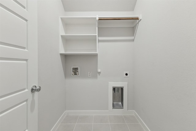 clothes washing area with hookup for a gas dryer, hookup for a washing machine, hookup for an electric dryer, and light tile patterned floors