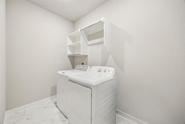 clothes washing area with washer and dryer