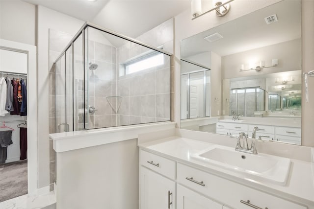 bathroom featuring vanity and walk in shower