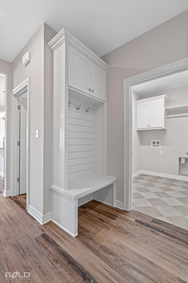 mudroom with light hardwood / wood-style floors