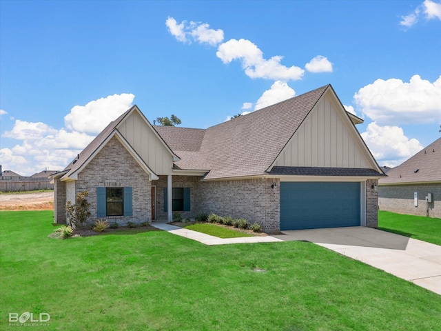 view of front of house featuring a garage and a front yard