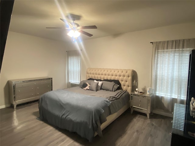 bedroom featuring ceiling fan and dark hardwood / wood-style floors