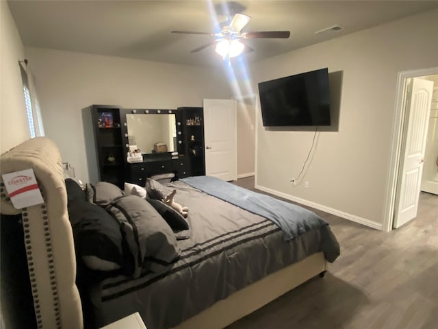 bedroom with hardwood / wood-style flooring and ceiling fan