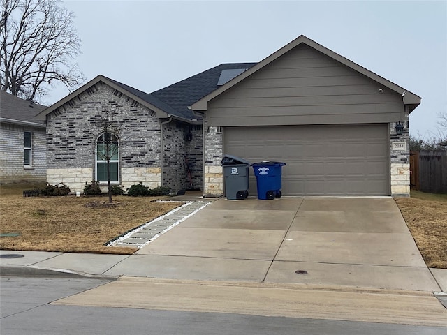 ranch-style house featuring a garage