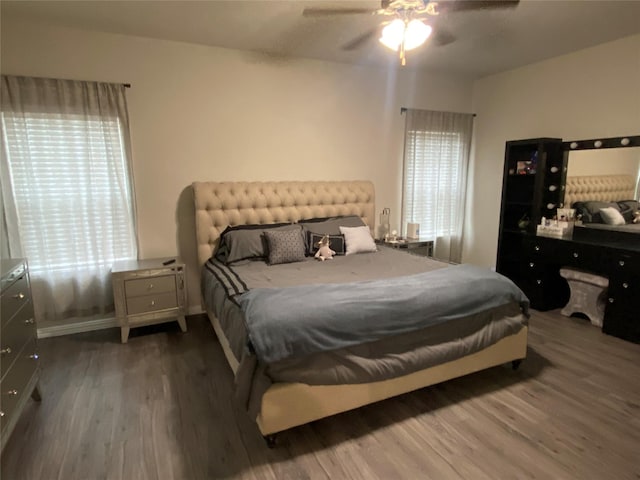 bedroom featuring hardwood / wood-style flooring and ceiling fan