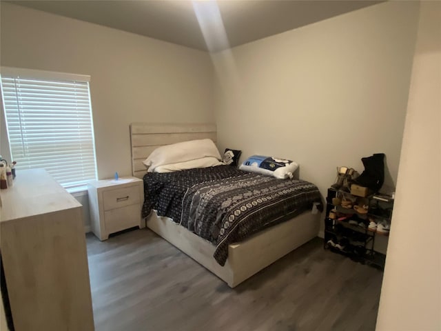 bedroom featuring dark hardwood / wood-style floors