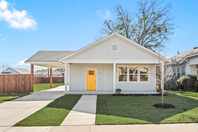 view of front of home featuring a front yard and covered porch