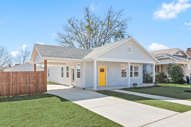 view of front facade with covered porch and a front yard