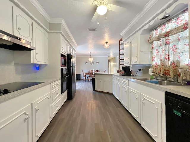 kitchen featuring sink, black appliances, ornamental molding, dark hardwood / wood-style floors, and white cabinets