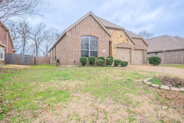 view of front of home with a garage and a front yard