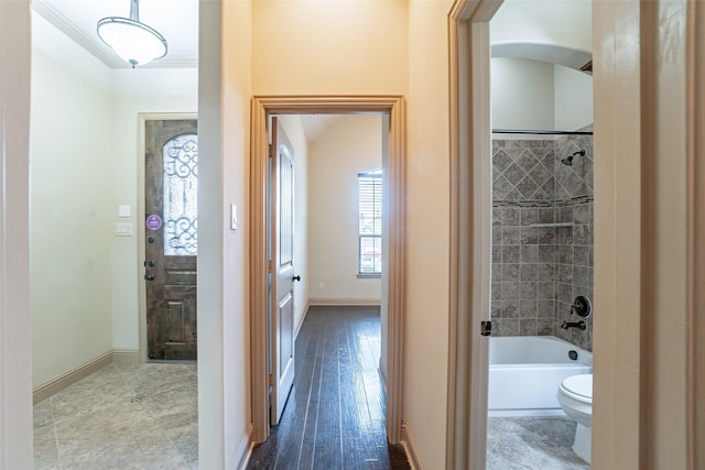 hallway featuring crown molding