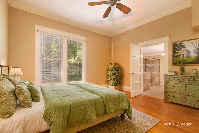 bedroom featuring ceiling fan, ornamental molding, and hardwood / wood-style floors