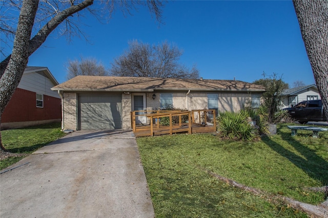 single story home featuring a wooden deck, a garage, and a front yard