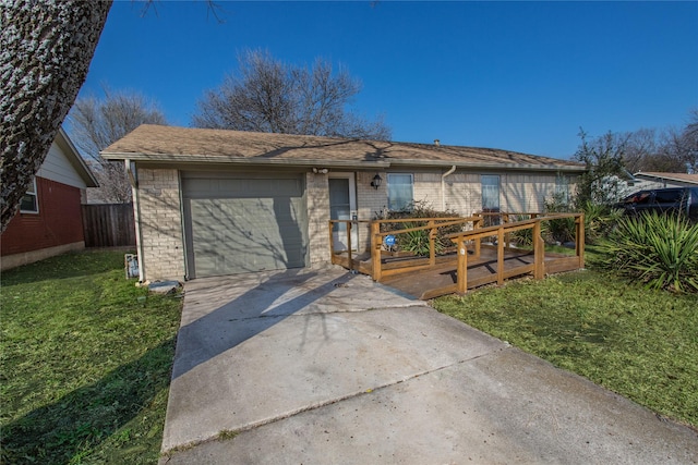 single story home with a garage and a front lawn